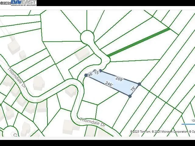 a white bath tub sitting next to a white bed and a chandelier