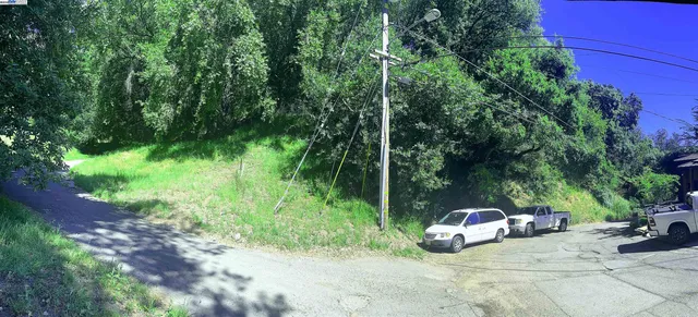 a view of a car is parked in front of a house