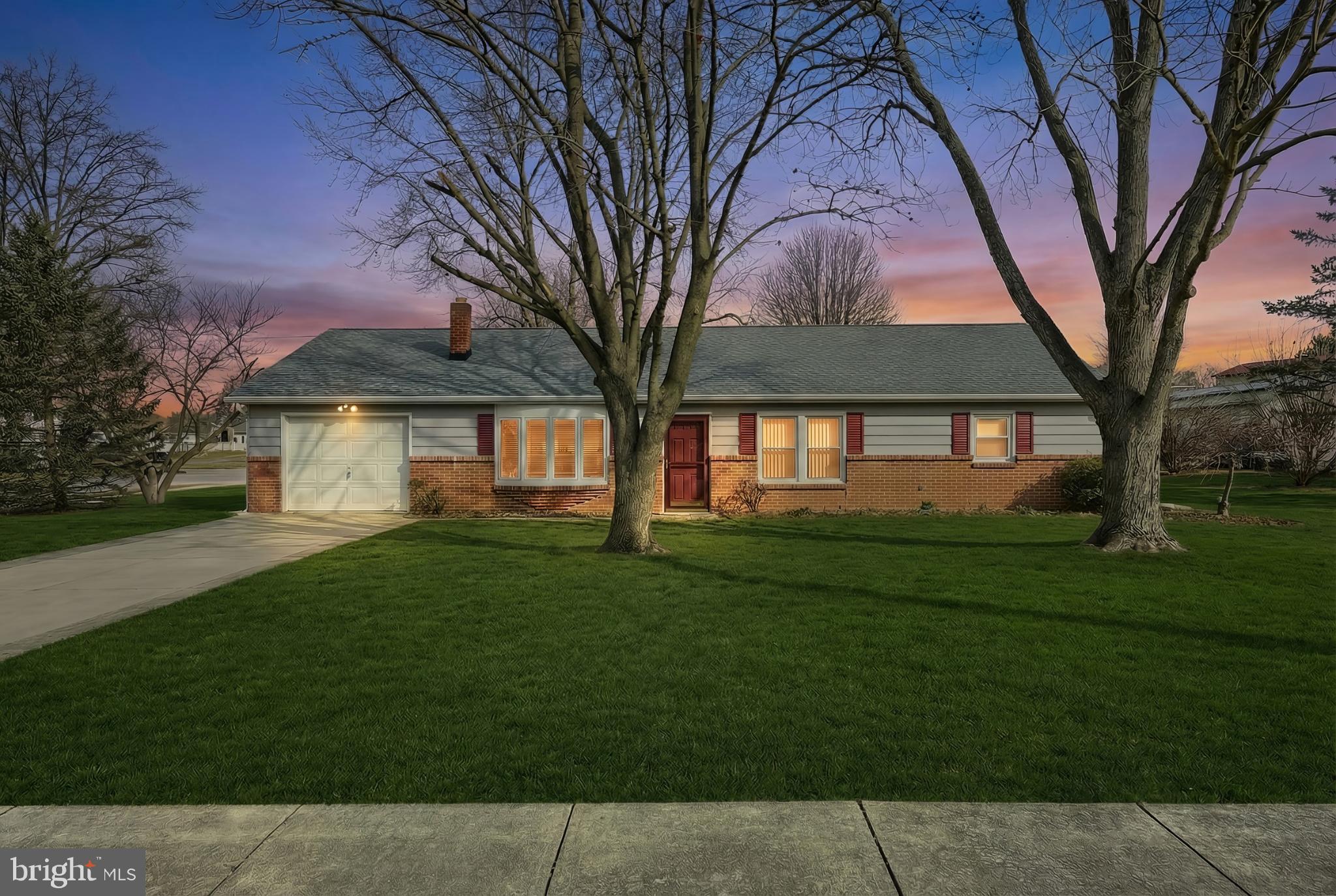 Charming home bathed in twilight hues.