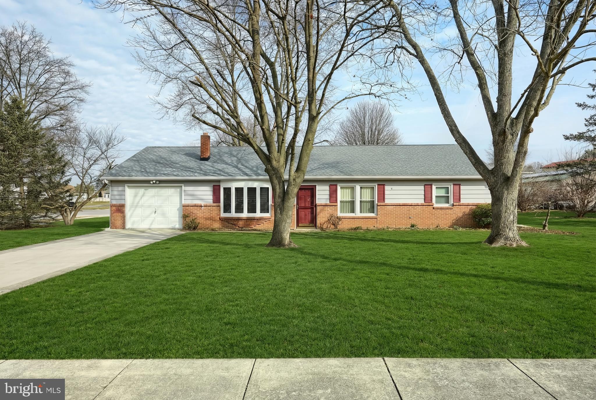 326 Park Heights Boulevard Hanover, PA 17331 - Photo 2 of 35 Charming brick home with lush green lawn.