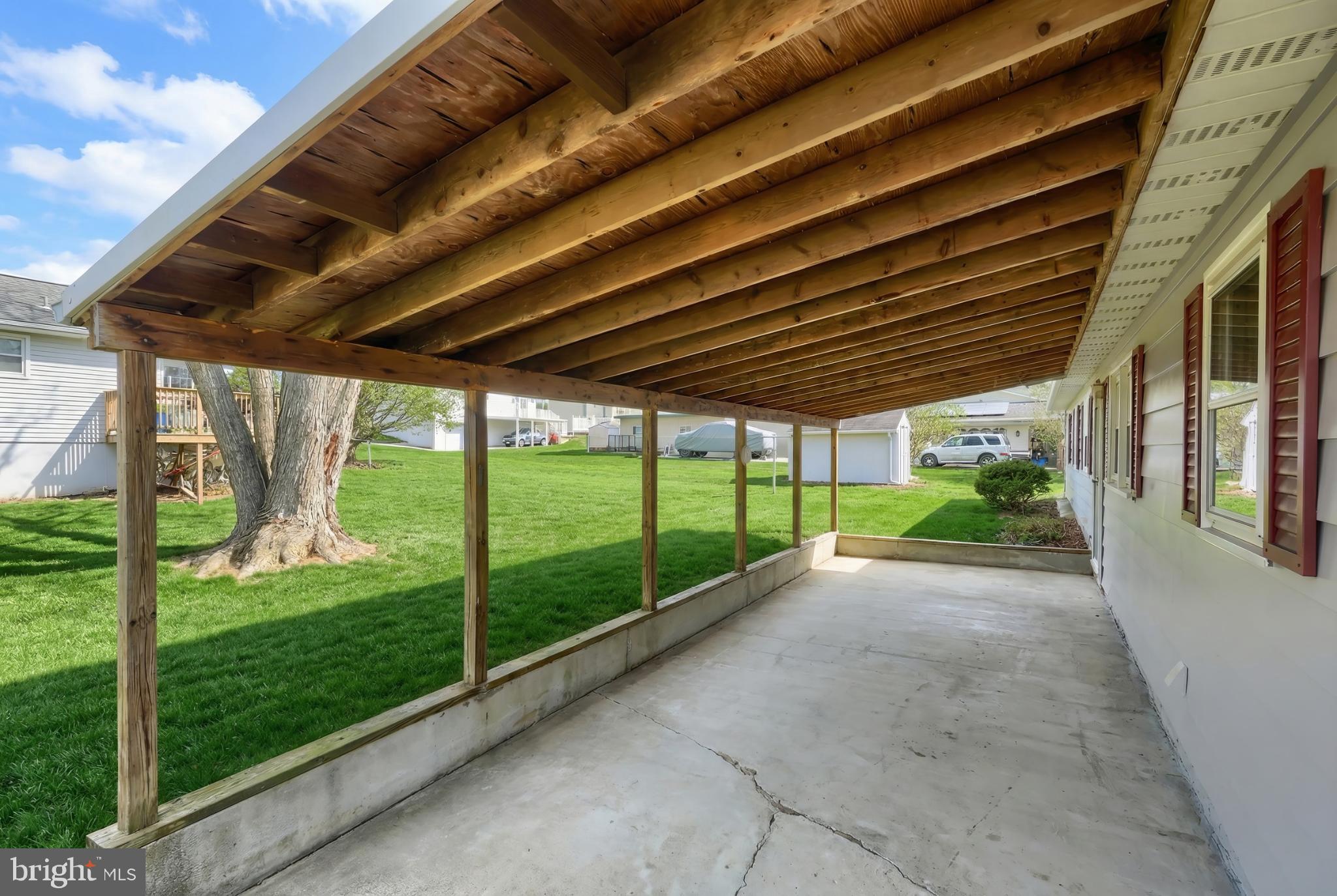 326 Park Heights Boulevard Hanover, PA 17331 - Photo 5 of 35 Inviting covered patio with lush green views.