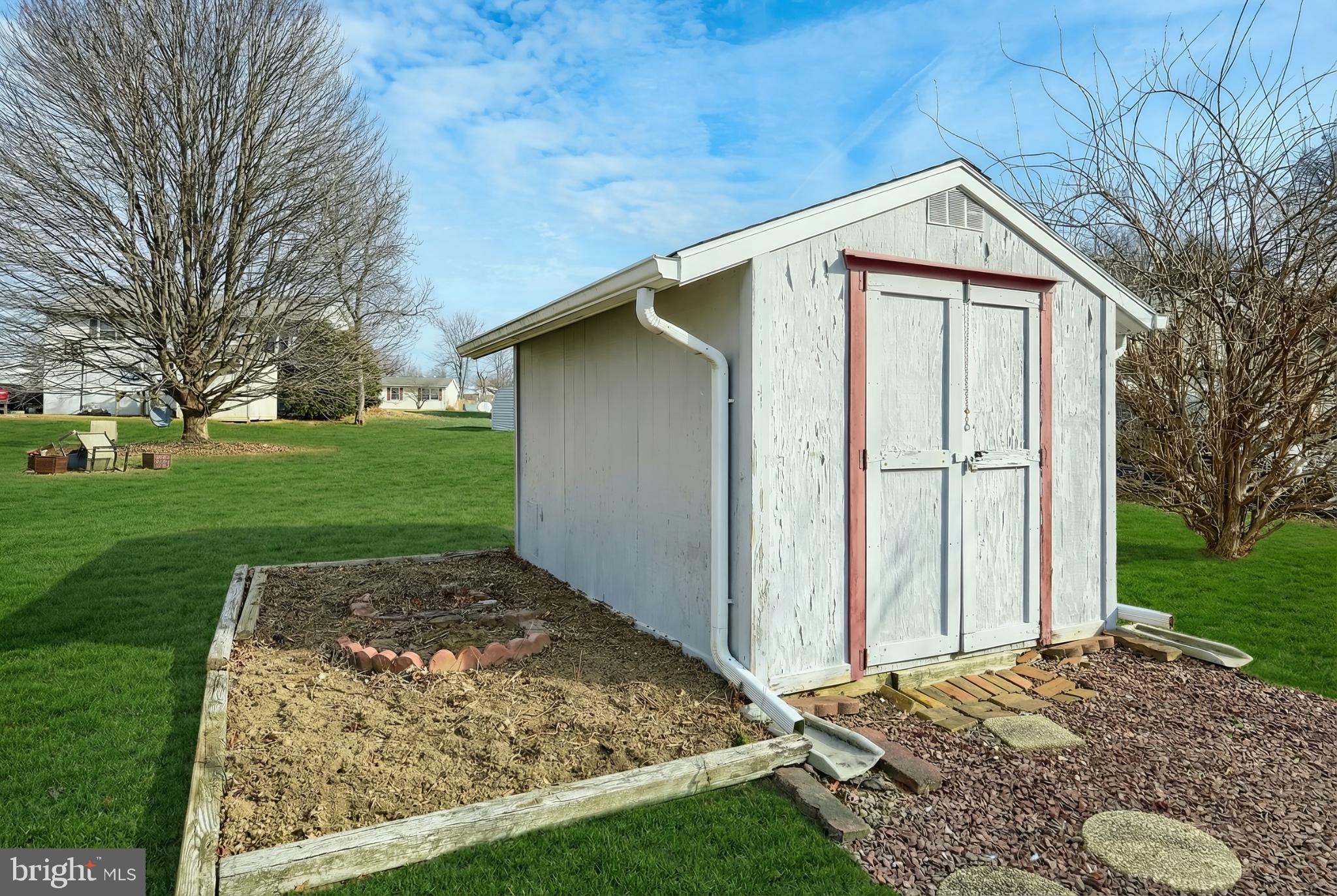 326 Park Heights Boulevard Hanover, PA 17331 - Photo 8 of 35 Charming garden shed in a serene setting.