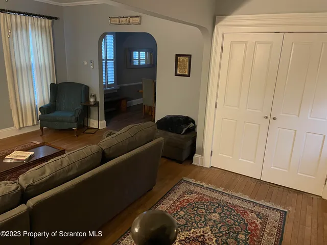 a living room with furniture and a rug