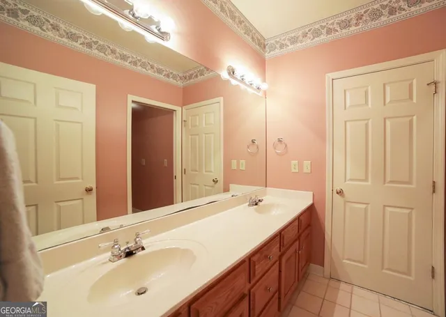 a bed room with a bed and a chandelier