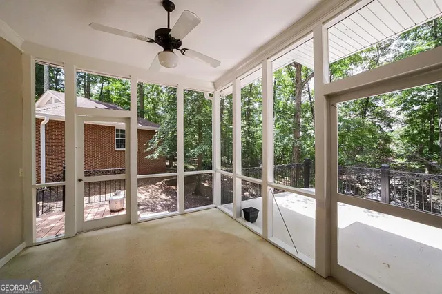 a view of a house with a tree