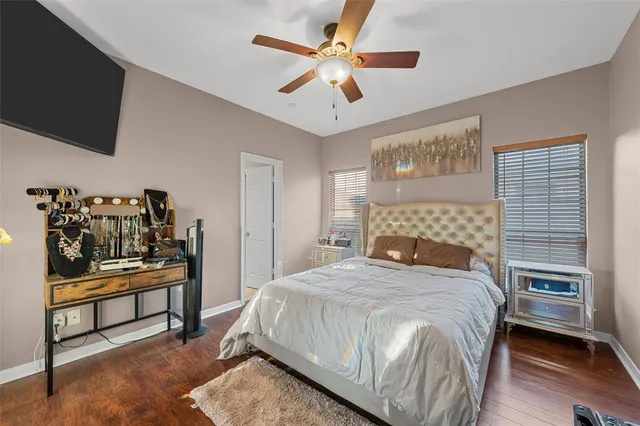 a view of room with furniture and wooden floor
