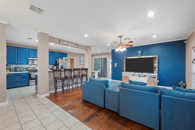 a living room with furniture and a flat screen tv