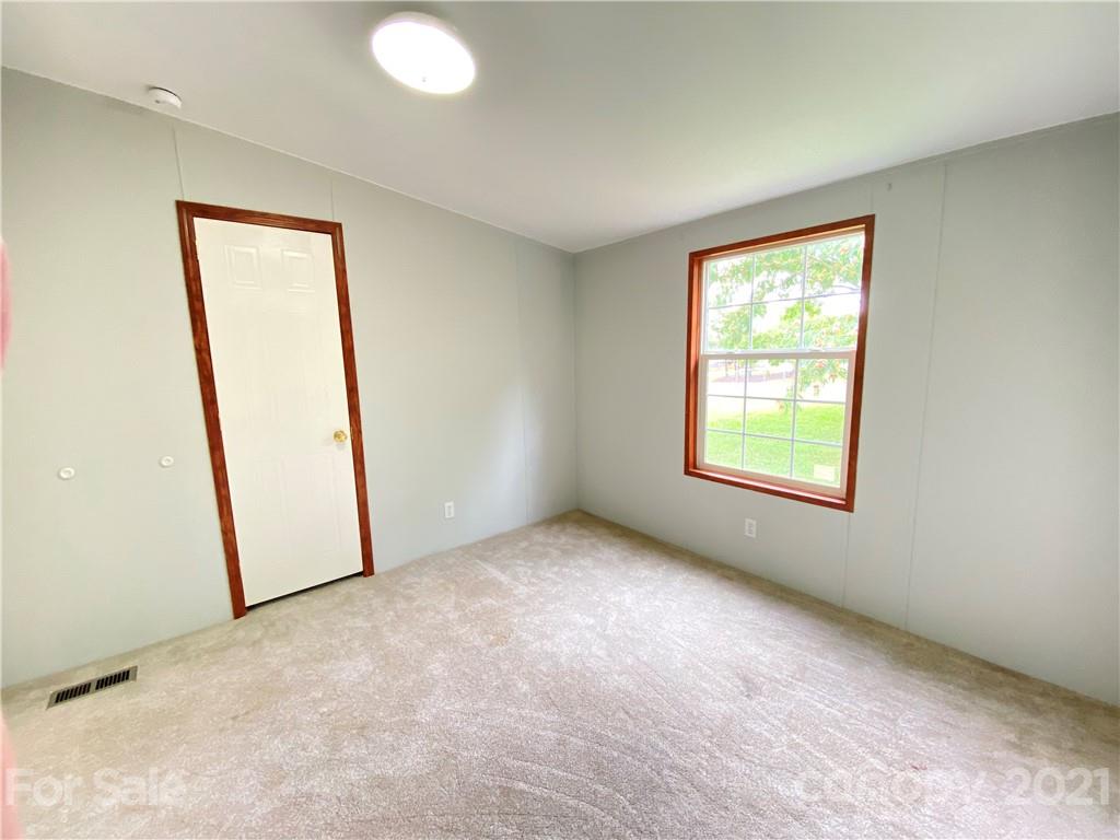 7210 Medlin Road Monroe, NC 28112 - Photo 15 of 30 an empty room with windows