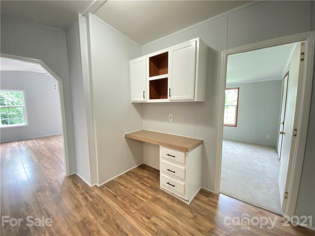 7210 Medlin Road Monroe, NC 28112 - Photo 24 of 30 a room with wooden floor and windows