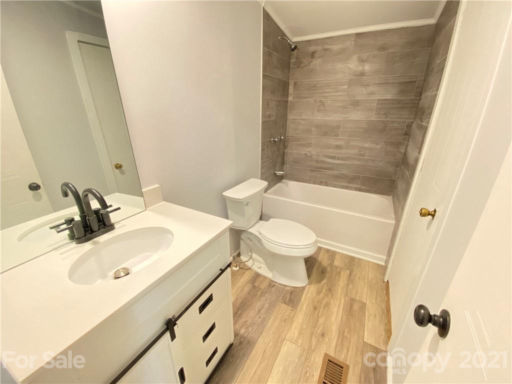7210 Medlin Road Monroe, NC 28112 - Photo 25 of 30 a bathroom with a sink toilet and shower