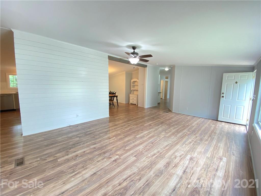 7210 Medlin Road Monroe, NC 28112 - Photo 7 of 30 wooden floor in an empty room with a window