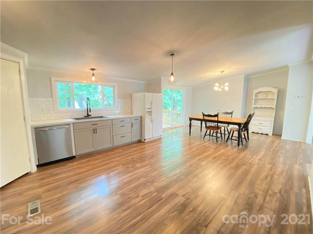 7210 Medlin Road Monroe, NC 28112 - Photo 10 of 30 a view of a kitchen and dining room