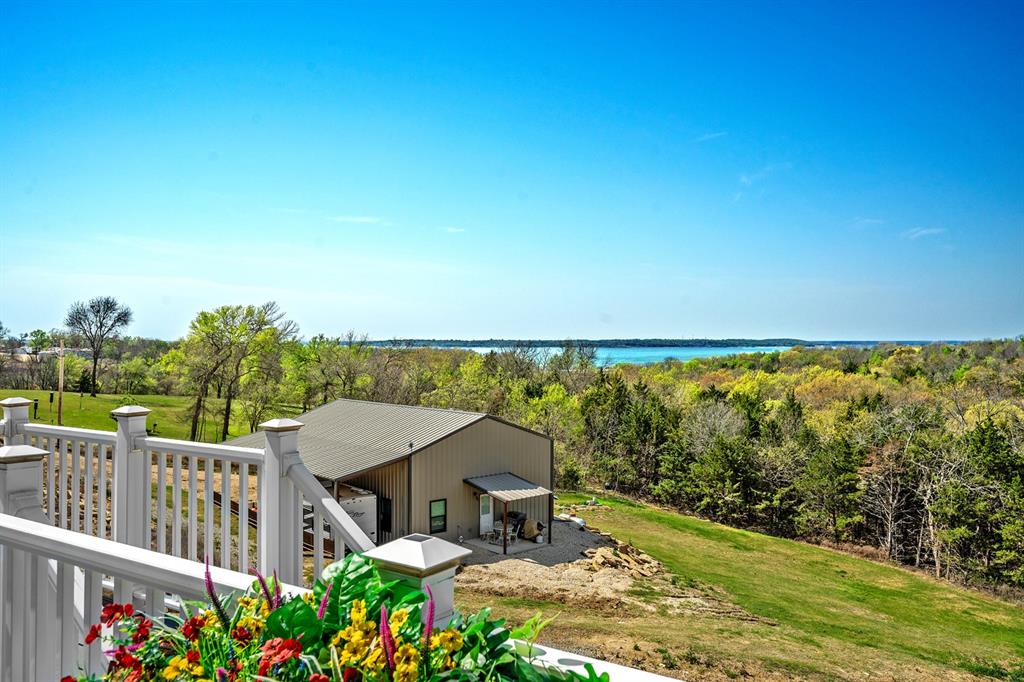 4509 Peach Tree Lane Kingston, OK 73439 - Photo 7 of 39 a view of a balcony with lake view and mountain view