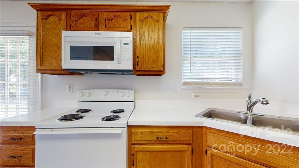 8821 Cameron Spring Road Charlotte, NC 28214 - Photo 15 of 40 a kitchen with a cabinets and a sink