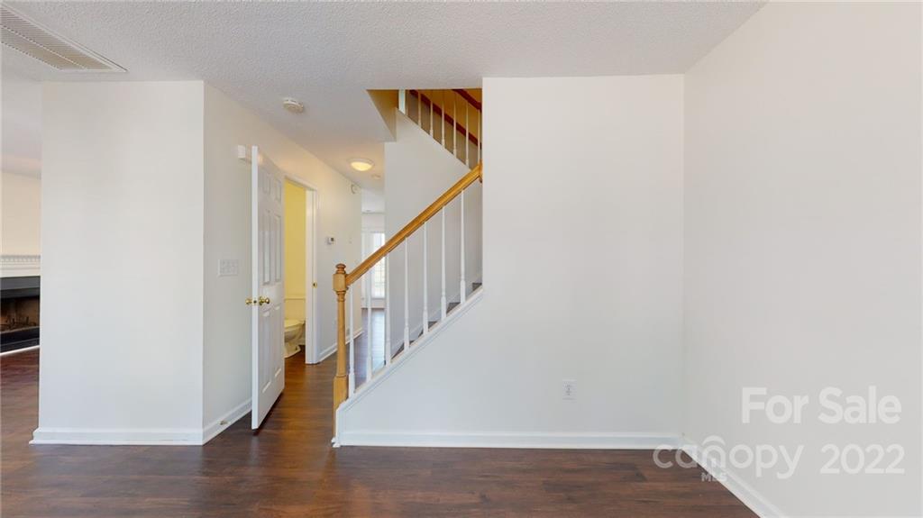 8821 Cameron Spring Road Charlotte, NC 28214 - Photo 20 of 40 a view of entryway with wooden floor