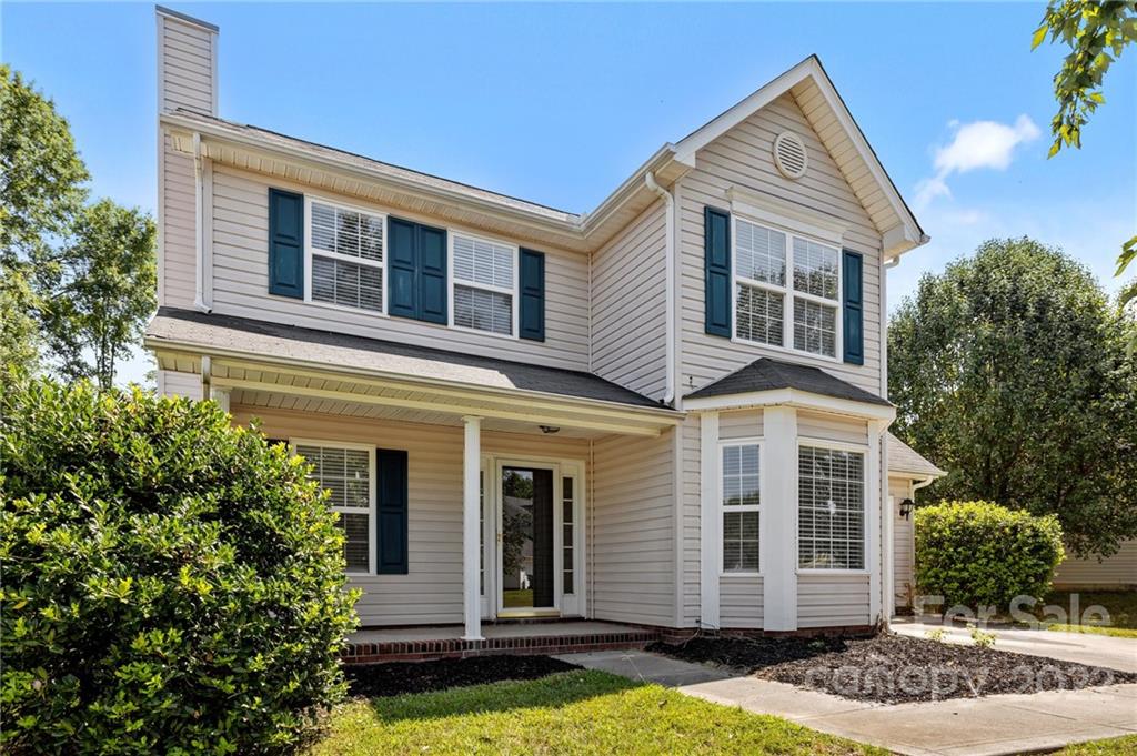8821 Cameron Spring Road Charlotte, NC 28214 - Photo 2 of 40 a front view of a house with garden