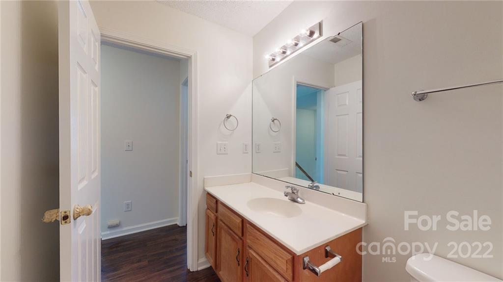 8821 Cameron Spring Road Charlotte, NC 28214 - Photo 27 of 40 a bathroom with a sink double vanity and a mirror