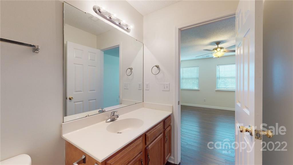 8821 Cameron Spring Road Charlotte, NC 28214 - Photo 31 of 40 a bathroom with a sink and a mirror