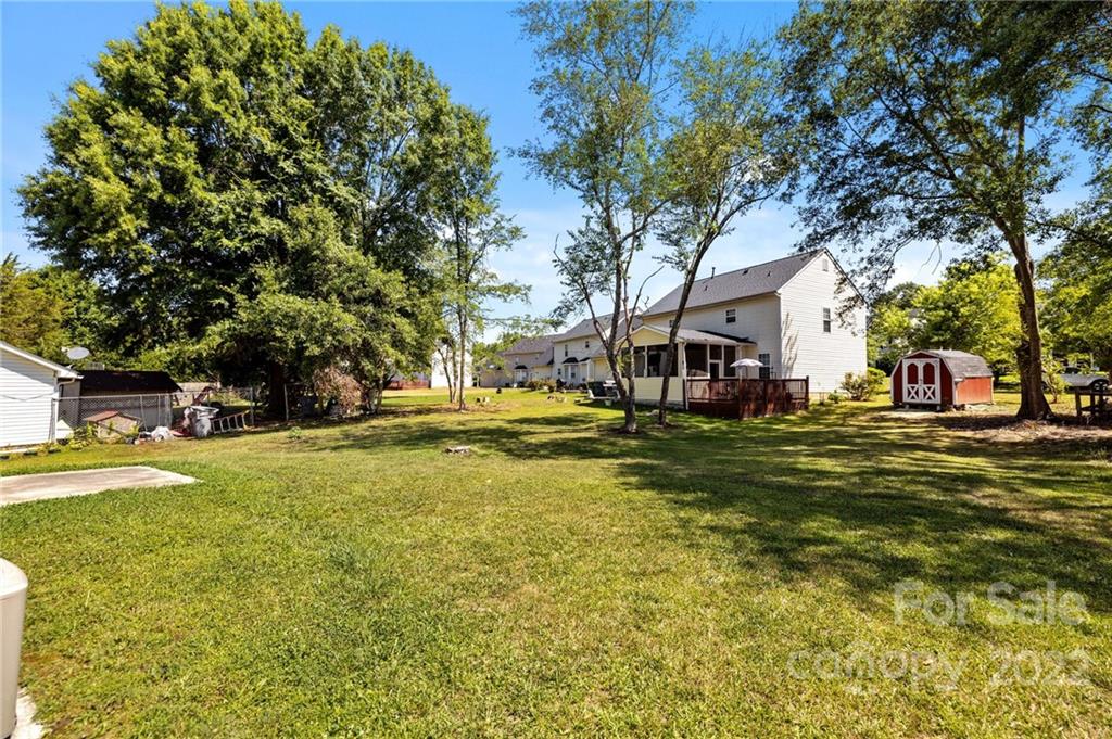 8821 Cameron Spring Road Charlotte, NC 28214 - Photo 35 of 40 a front view of a house with a large tree