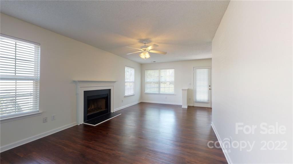 8821 Cameron Spring Road Charlotte, NC 28214 - Photo 8 of 40 a view of livingroom with window fireplace