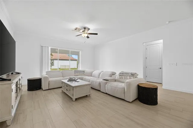 a large bathroom with a large tub sink vanity and granite