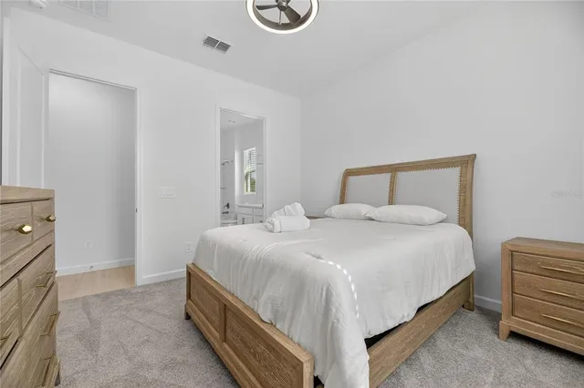 a view of a kitchen with wooden floor and electronic appliances