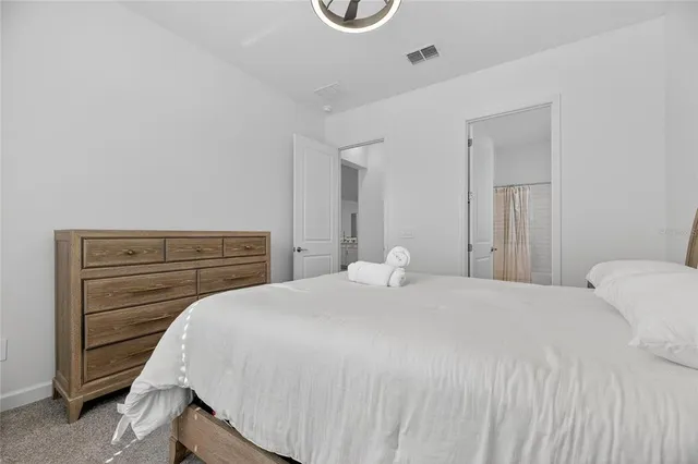 a view of a kitchen with dining table and chairs