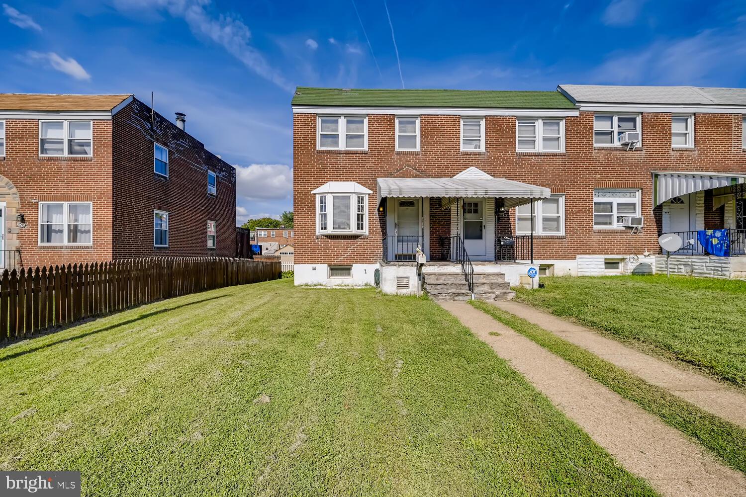 318 Arden Road West Baltimore, MD 21225 - Photo 2 of 32 a front view of a house with a yard