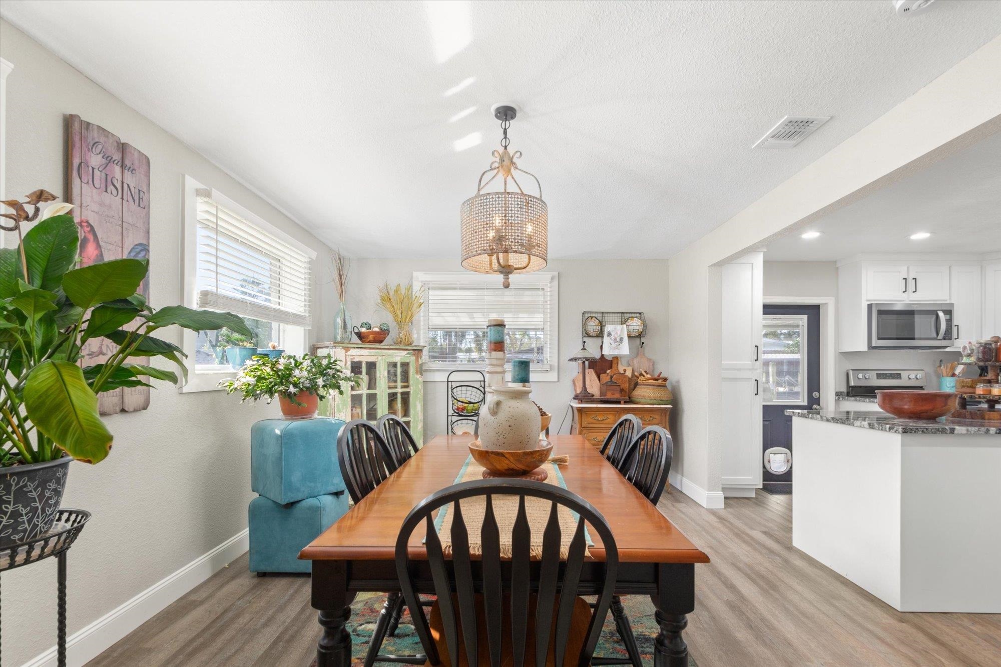 107 Betty Road Crescent City, FL 32112 - Photo 13 of 65 a view of a dining room with furniture window and wooden floor