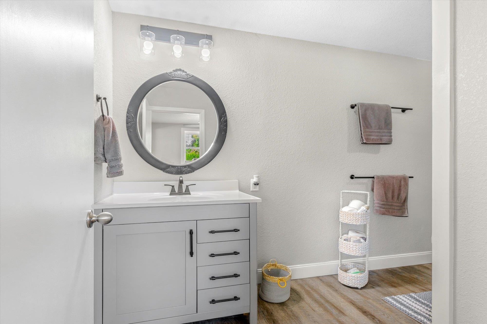 107 Betty Road Crescent City, FL 32112 - Photo 15 of 65 a bathroom with a toilet sink and mirror