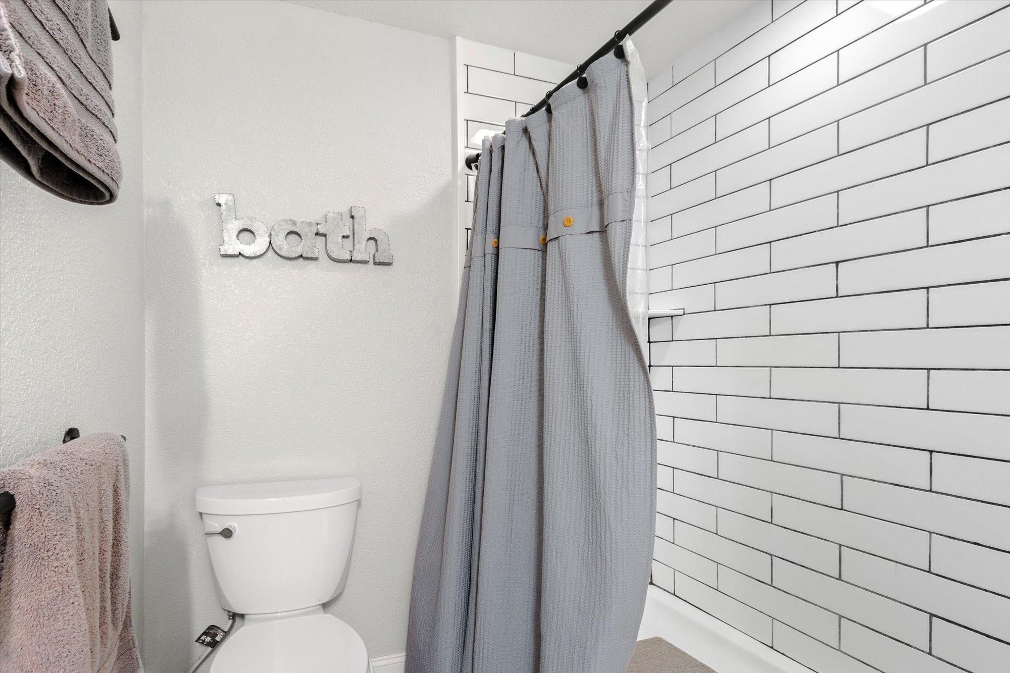 107 Betty Road Crescent City, FL 32112 - Photo 16 of 65 a bathroom with a toilet and a shower
