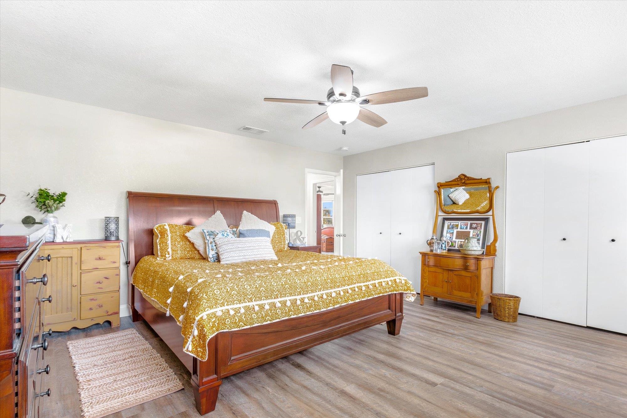 107 Betty Road Crescent City, FL 32112 - Photo 21 of 65 a bedroom with a bed and a lamp on the dresser