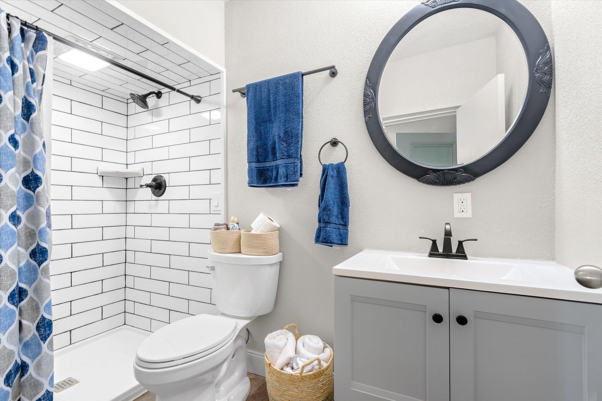 107 Betty Road Crescent City, FL 32112 - Photo 30 of 65 a bathroom with a toilet a sink and a mirror