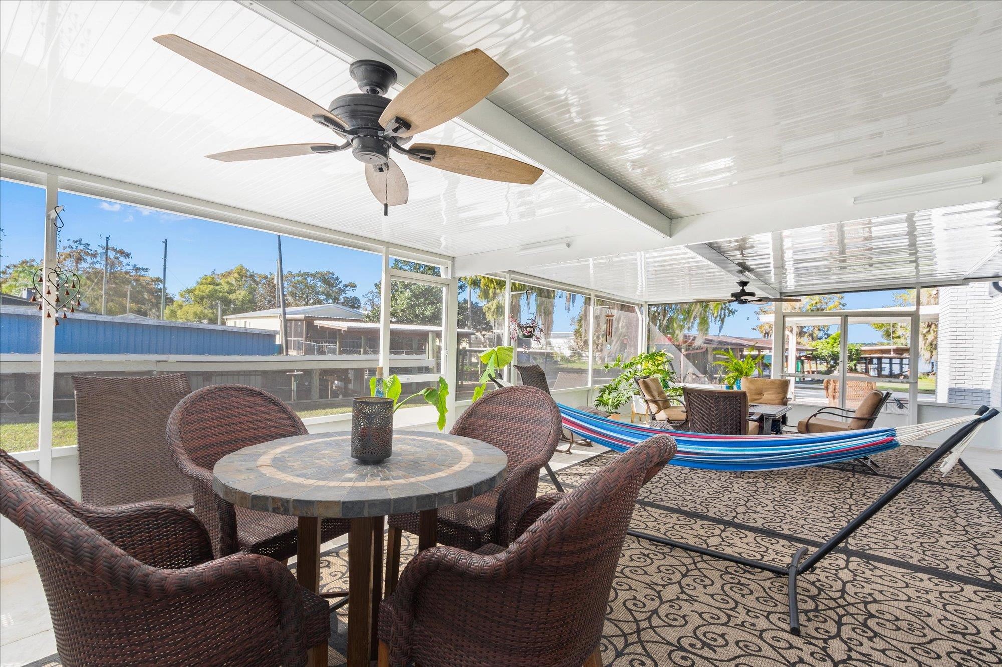 107 Betty Road Crescent City, FL 32112 - Photo 33 of 65 a dining room with furniture and a floor to ceiling window