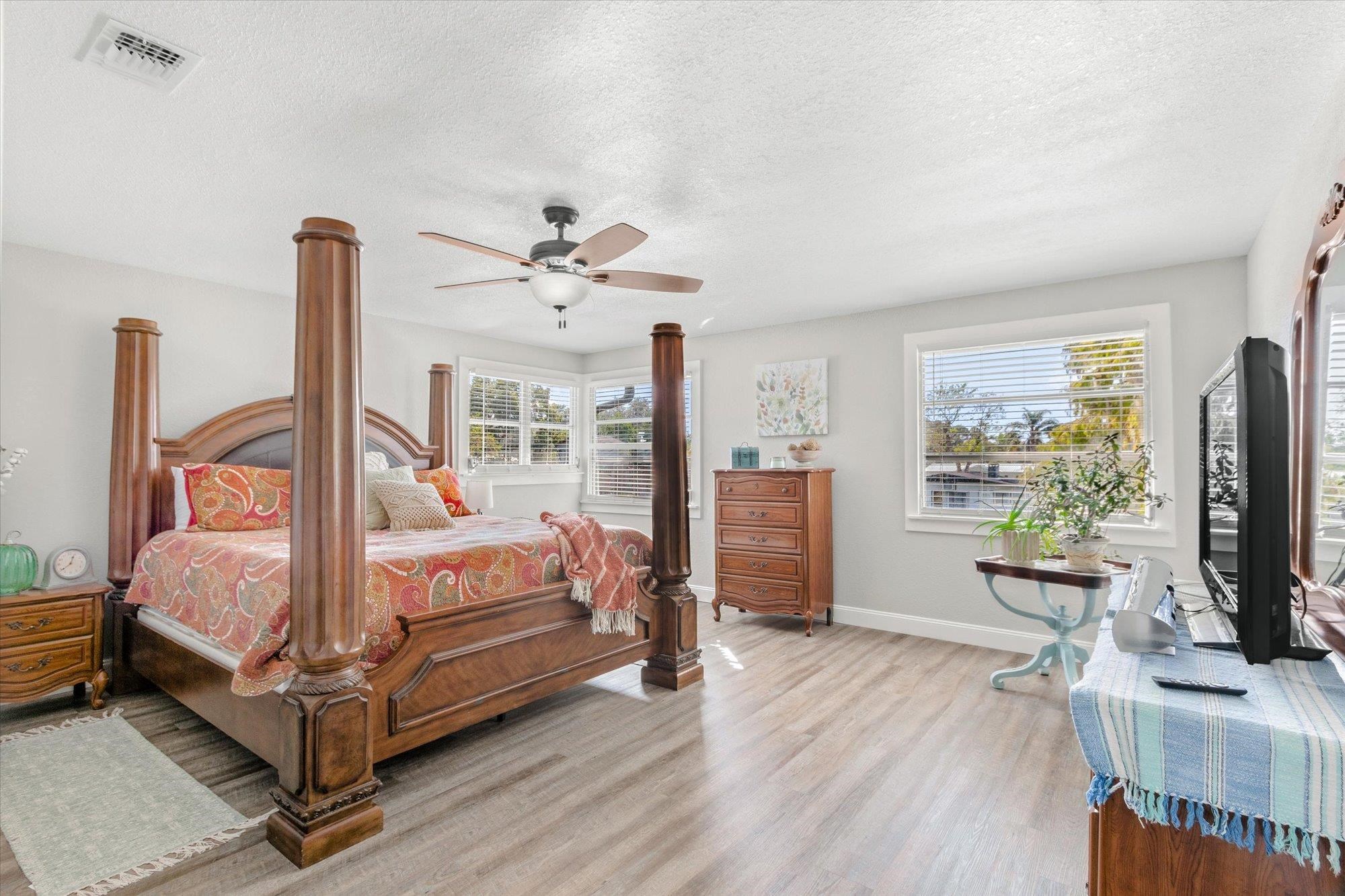 107 Betty Road Crescent City, FL 32112 - Photo 34 of 65 a bedroom with a bed and wooden floor