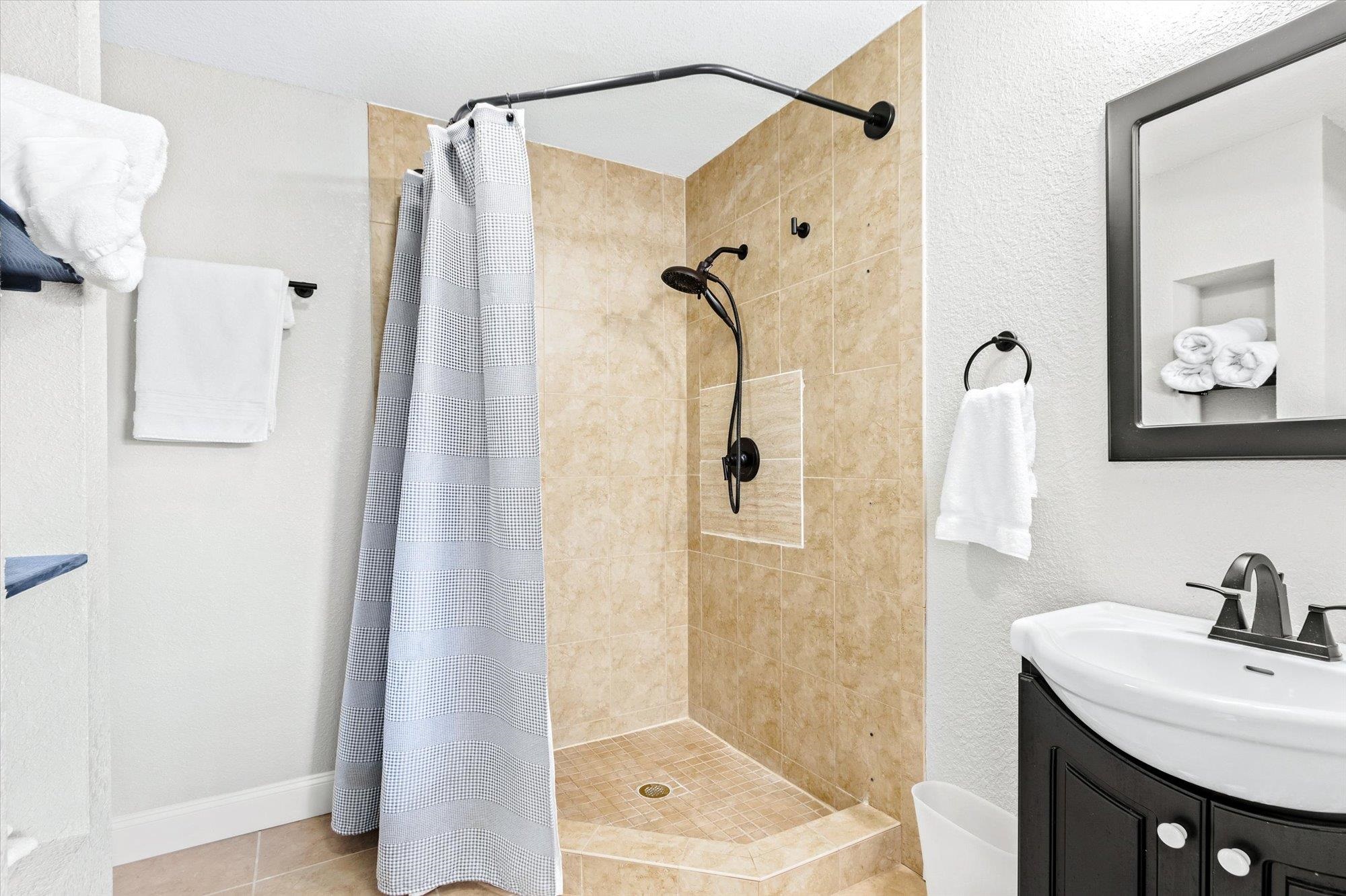 107 Betty Road Crescent City, FL 32112 - Photo 36 of 65 a bathroom with a shower sink and mirror