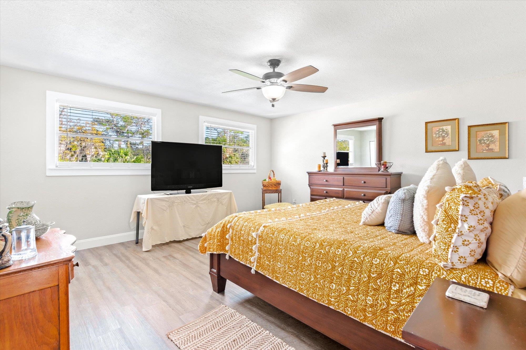 107 Betty Road Crescent City, FL 32112 - Photo 37 of 65 a bedroom with a bed and a flat screen tv
