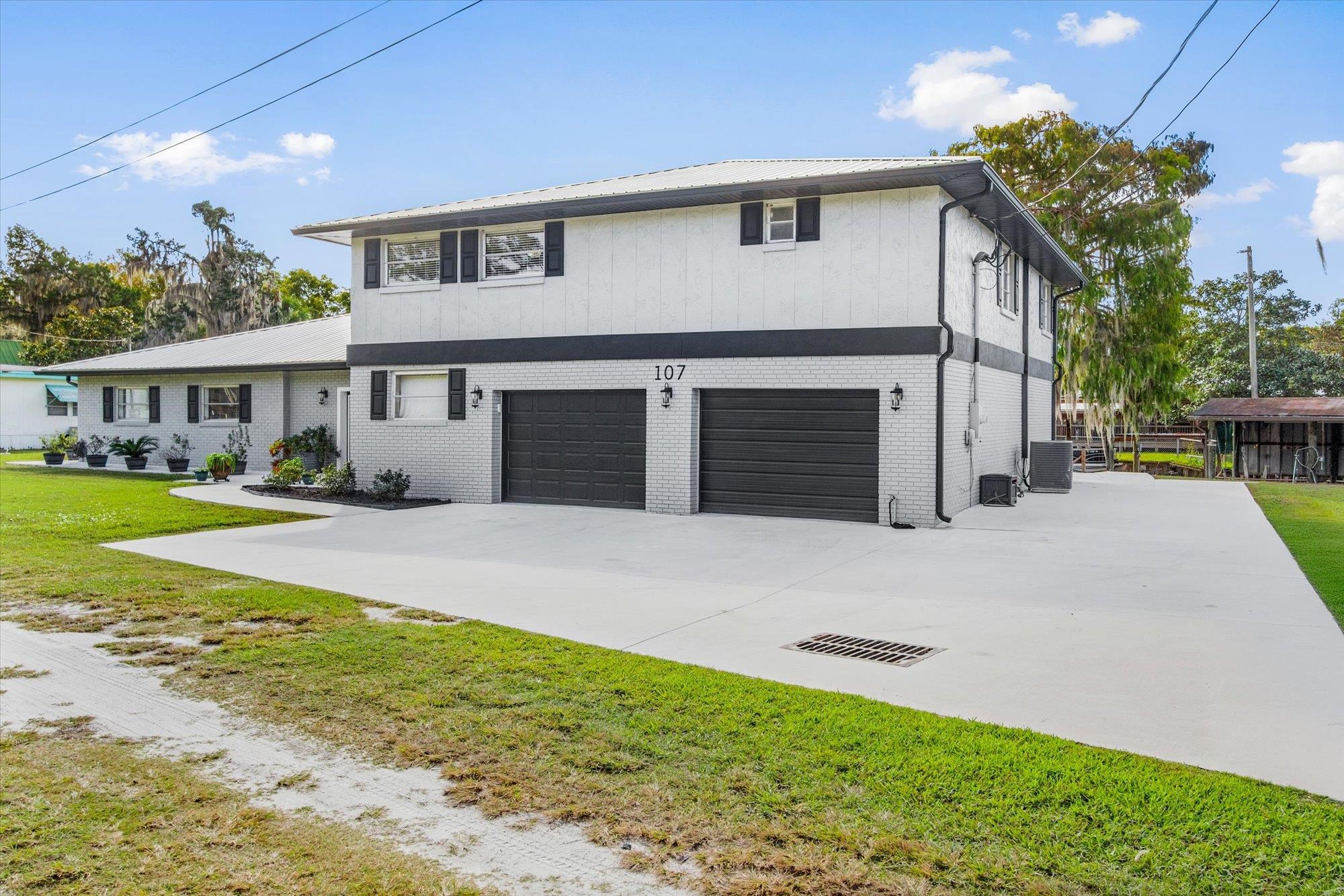 107 Betty Road Crescent City, FL 32112 - Photo 41 of 65 a front view of a house with garden