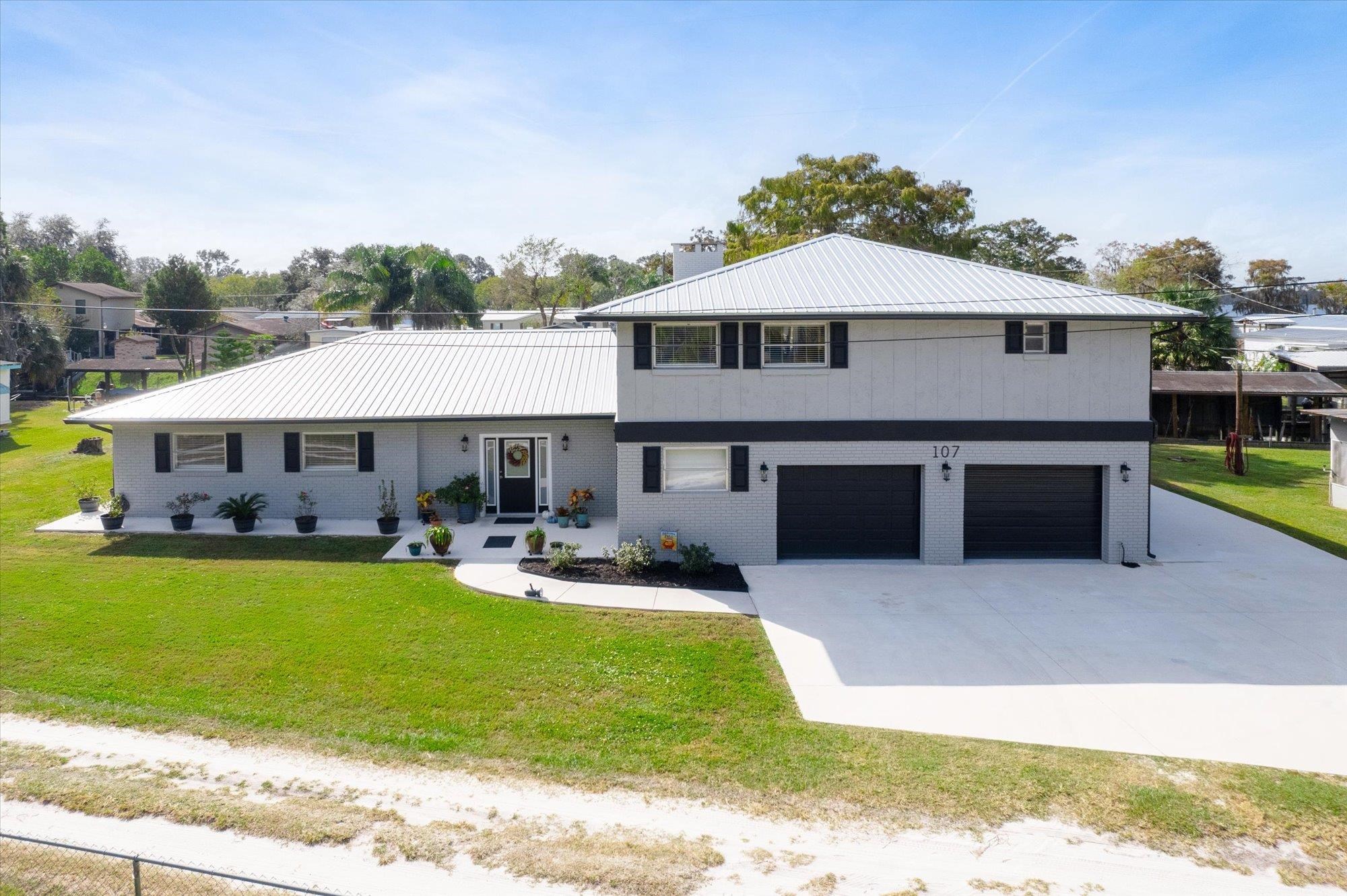 107 Betty Road Crescent City, FL 32112 - Photo 45 of 65 a front view of a house with garden and porch