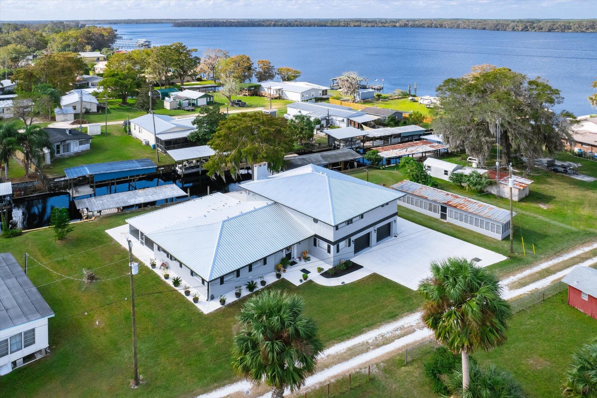 107 Betty Road Crescent City, FL 32112 - Photo 46 of 65 an aerial view of a house with a garden and lake view
