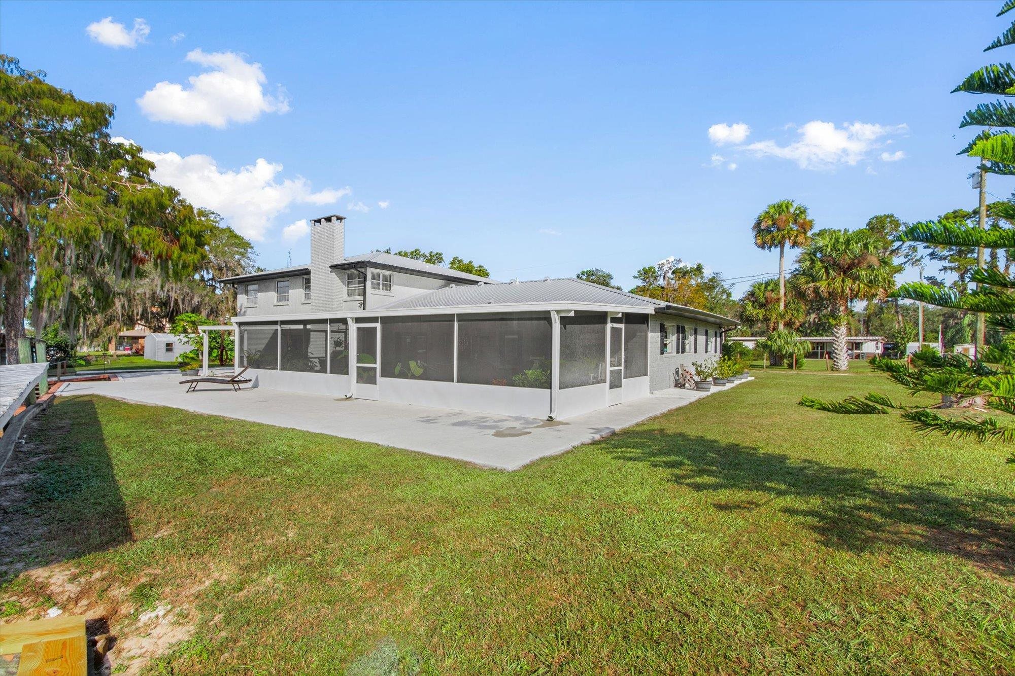 107 Betty Road Crescent City, FL 32112 - Photo 56 of 65 a view of a house with a yard