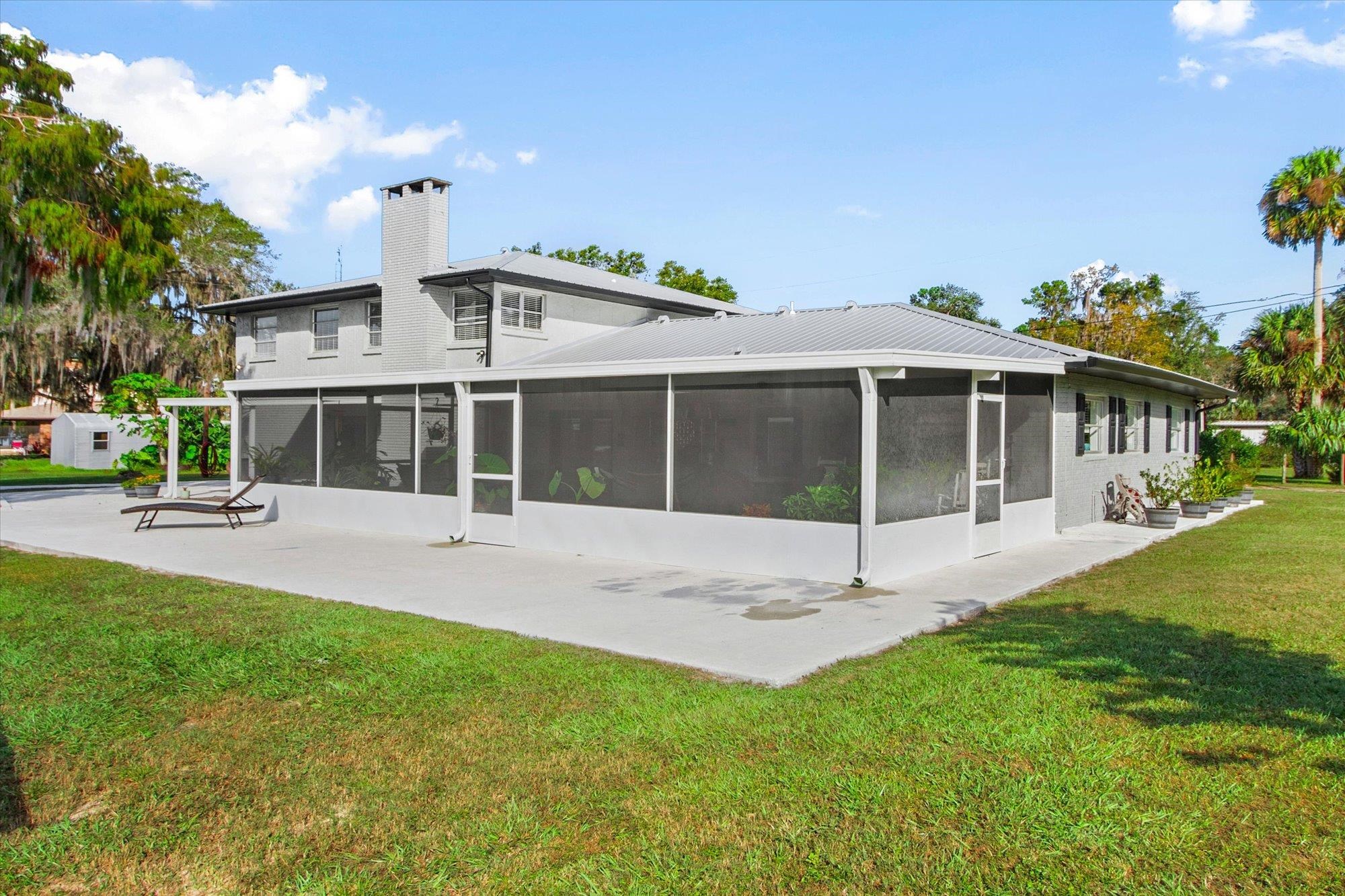 107 Betty Road Crescent City, FL 32112 - Photo 57 of 65 a view of a house with a yard and a porch
