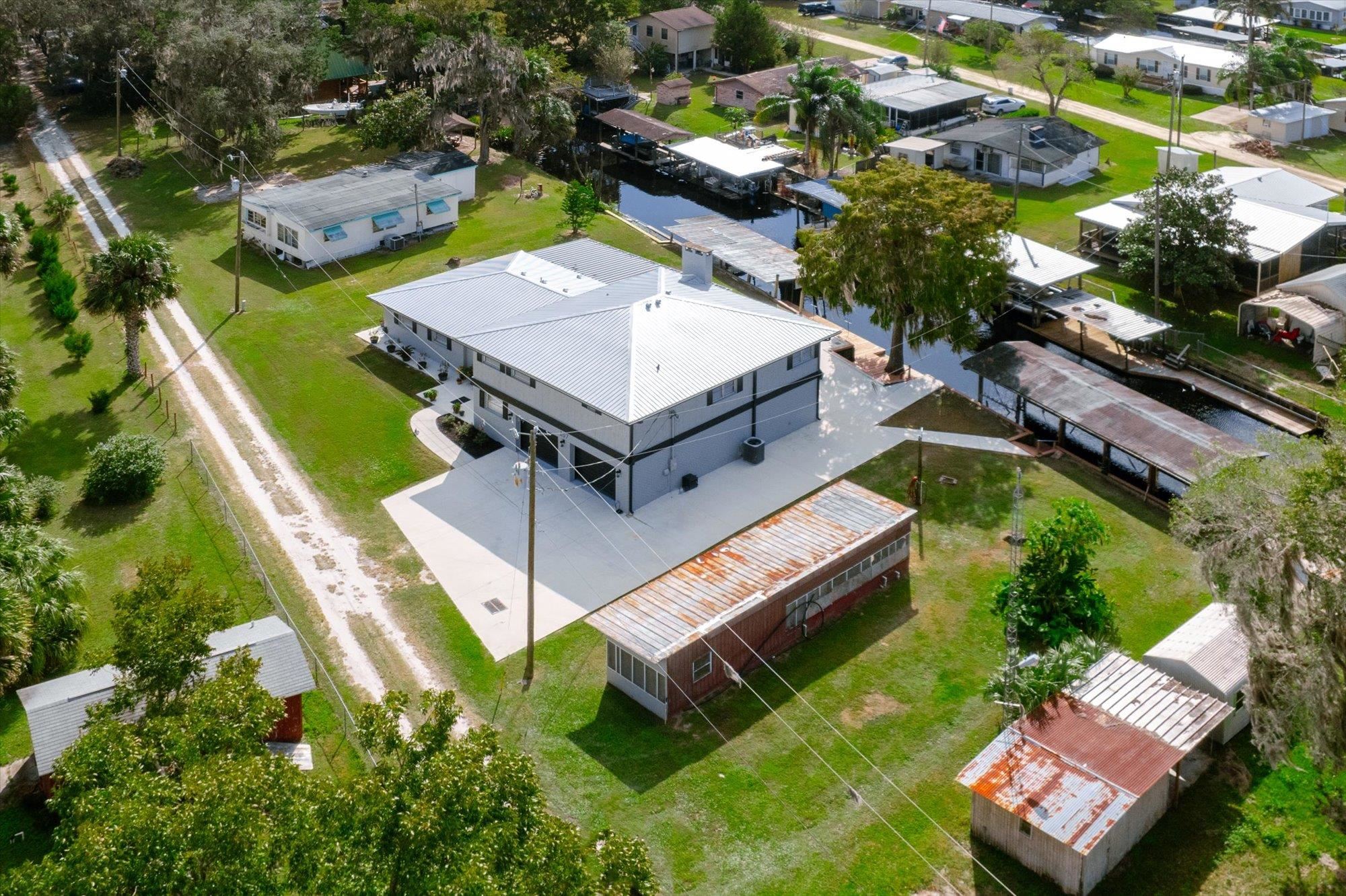107 Betty Road Crescent City, FL 32112 - Photo 65 of 65 an aerial view of a house with a garden and swimming pool