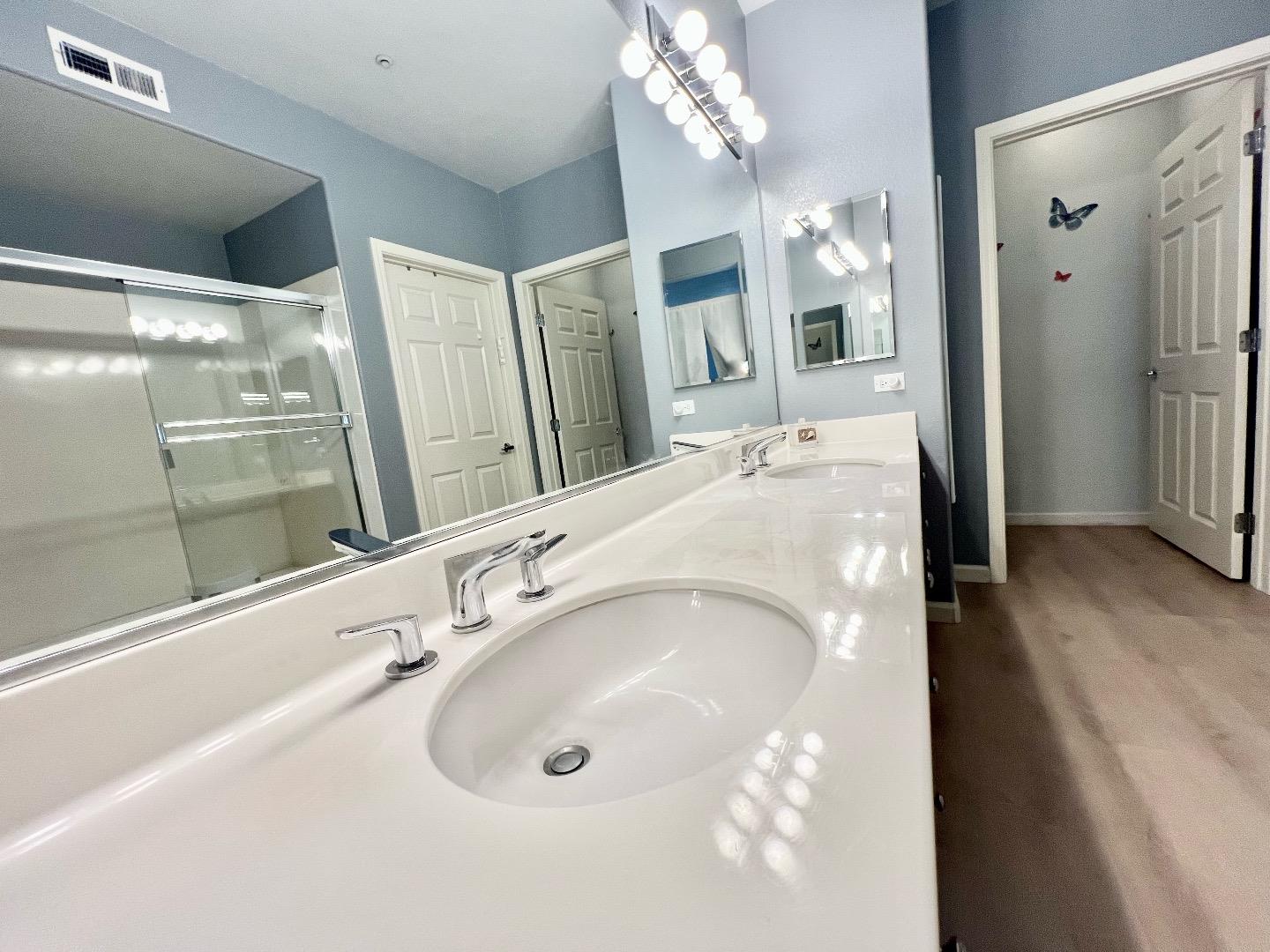 1310 Saddle Rack Street, Unit 347 San Jose, CA 95126 - Photo 21 of 42 a bathroom with a tub sink and a mirror