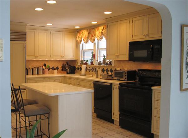 45 Ward Street Lexington, MA 02421 - Photo 4 of 18 a kitchen with a sink and a refrigerator