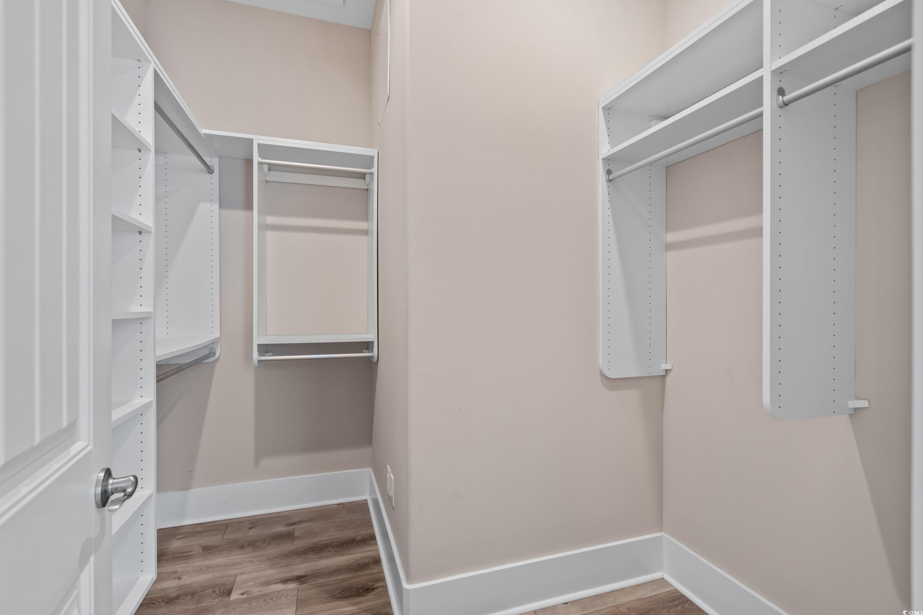 3048 Moss Bridge Lane Myrtle Beach, SC 29579 - Photo 24 of 40 Walk in closet featuring wood-type flooring