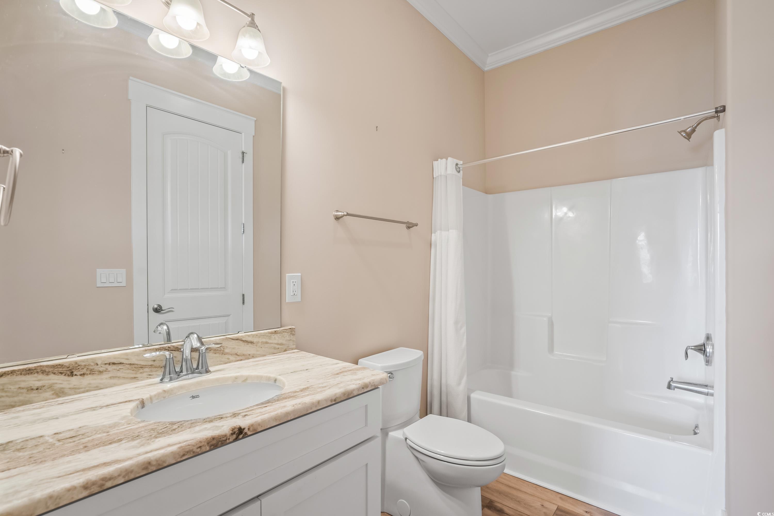 3048 Moss Bridge Lane Myrtle Beach, SC 29579 - Photo 26 of 40 Full bathroom featuring vanity, crown molding, toi