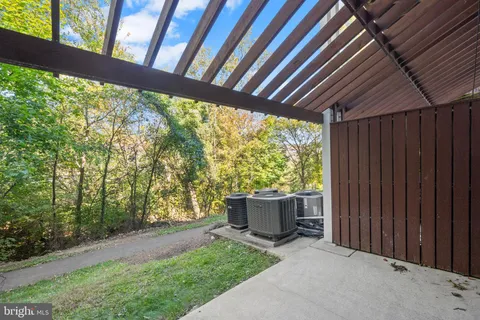 a view of backyard with plants and outdoor seating