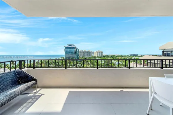 a view of swimming pool and city from a terrace