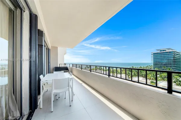 a view of balcony with furniture